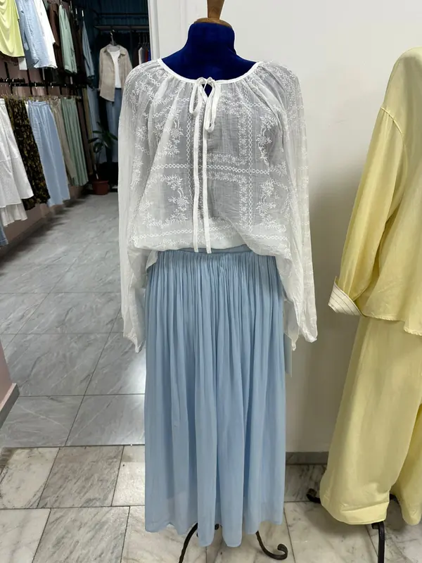 White blouse and blue skirt before AI enhancement